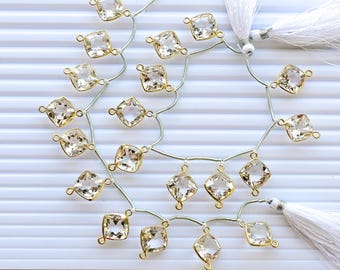 Conjunto de 10 peças de cristais de quartzo facetados com corte almofada, banhados a ouro e engastados em bisel. Contas de pedras preciosas naturais | 14x15x8 a 14x14x8 mm