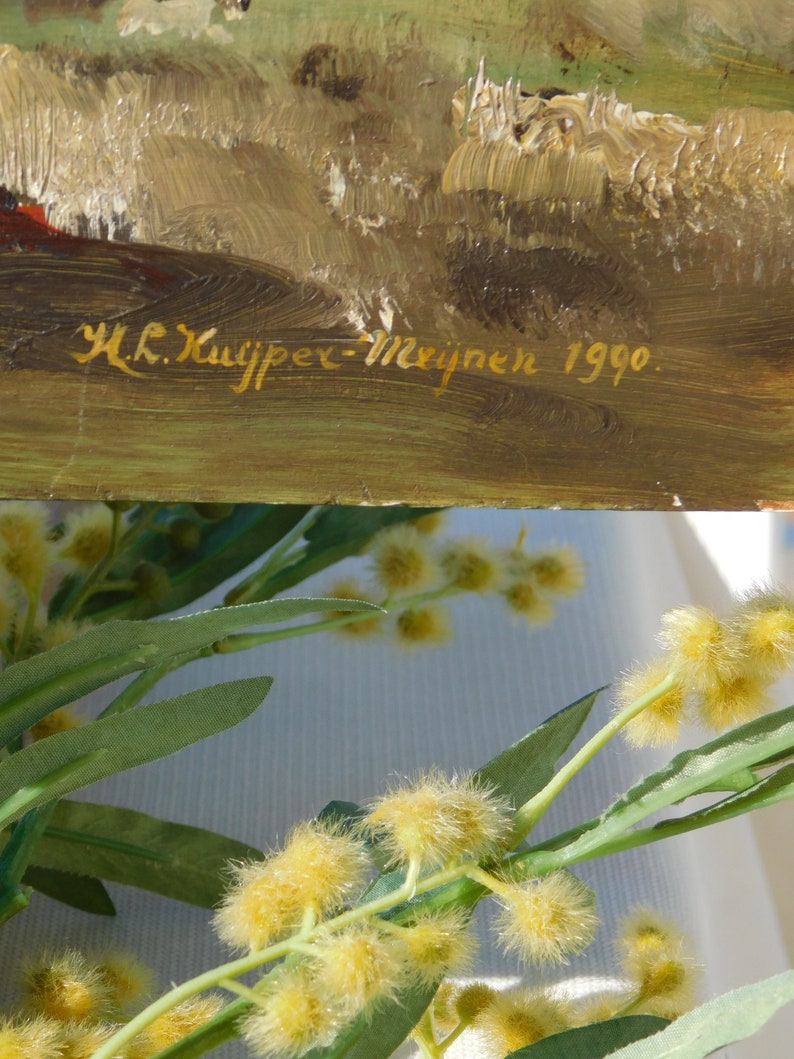 May include: A close-up of a painting with a signature in gold lettering that reads "H.K. Kuijper-Meijnen 1990".