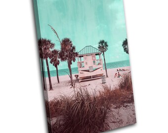 May include: A pastel pink and white beach hut with a turquoise sky and palm trees in the background. The beach hut is on a sandy beach with tall grass in the foreground.