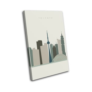 May include: A canvas print featuring a minimalist illustration of the Toronto skyline. The artwork showcases the city's iconic buildings in shades of gray, blue, and beige against a light background. The word "TORONTO" is printed at the top.