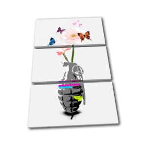May include: A three-piece canvas print featuring a grey grenade with a peace sign on the pin. A pink flower with butterflies in blue, orange, and purple is growing out of the grenade.
