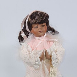 Porcelain praying angel doll on sale
