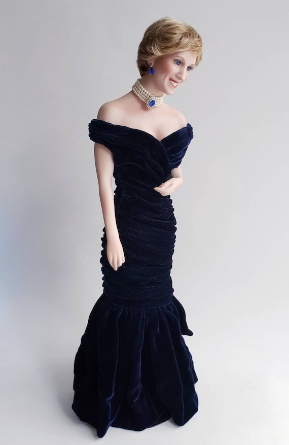 princess diana blue velvet dress In 1985, Princess Diana shared a special dance with @johntravolta at the  @whitehouse wearing a midnight blue velvet gown designed by Victor  Edelstein. Today, fashion history identifies the iconic dress as simply