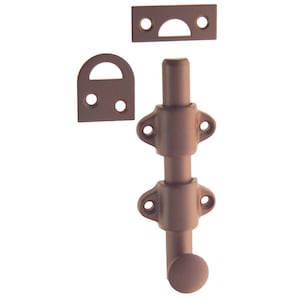 May include: A bronze-colored door bolt with a round knob and two locking plates. The bolt is designed to be installed on a door to prevent it from opening.