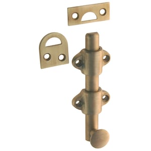 May include: A brass door bolt with a round knob and two strike plates. The bolt is designed to be used on a door or window to prevent it from being opened.