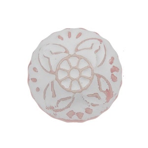 May include: White ceramic knob with a pink background and a floral design.