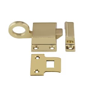 May include: A brass window latch with a loop handle, a strike plate, and a keeper. The latch is designed to secure a window from the inside.