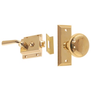 May include: A polished brass door lock set with a lever handle, a round knob, and a strike plate. The set includes all the necessary hardware for installation.