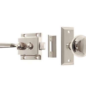 May include: A polished nickel door knob set with a lever handle and a round knob. The set includes a latch, strike plate, and a separate knob.