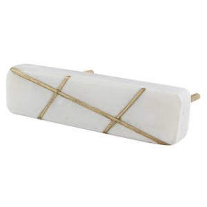 May include: White marble cabinet pull with a brass crosshatch design.