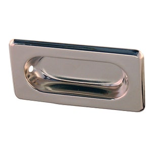May include: A chrome-plated rectangular cabinet pull with a recessed oval handle. The pull has a single hole for mounting.