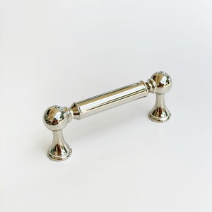 Polished Nickel Transitional "Queen" Cabinet Knob and Pulls