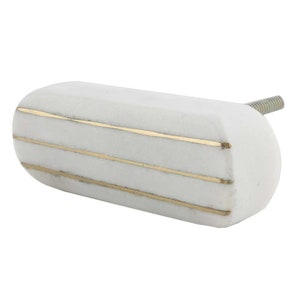 May include: White ceramic cabinet knob with three gold stripes.