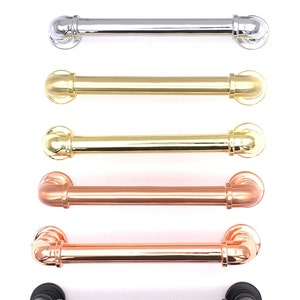 May include: Six industrial style cabinet pulls in different finishes: nickel, chrome, brass, polished brass, copper, and black.