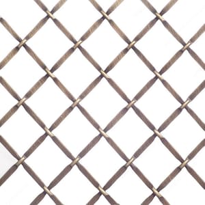 May include: A close-up of a metallic wire mesh with a diamond pattern. The mesh is a light gold color and has a slightly textured surface.