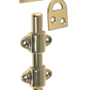May include: A polished brass door bolt with a round knob and two mounting plates. The bolt is designed to be installed on a door to secure it.