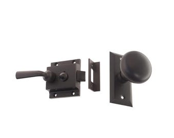May include: A black door latch set with a lever handle and a round knob. The set includes a strike plate and a latch.