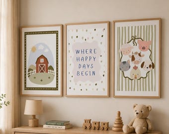 May include: Three framed wall art prints featuring a red barn, the text WHERE HAPPY DAYS BEGIN, and a collection of farm animal faces. The prints are displayed in light wood frames above a wooden dresser with six drawers and a teddy bear.