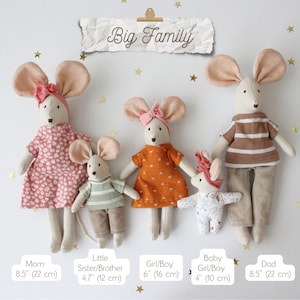 May include: A family of five handmade mouse dolls, each with large ears and dressed in various outfits. The dolls are arranged on a white background with gold star accents. The banner above reads "Big Family".