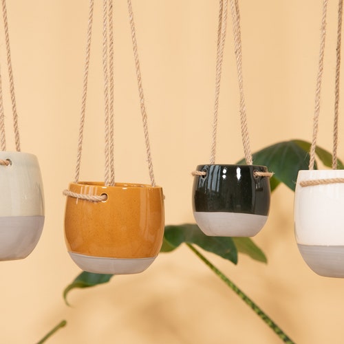 Minimalist hanging ceramic pot with suspension made of rope ceramic concrete look