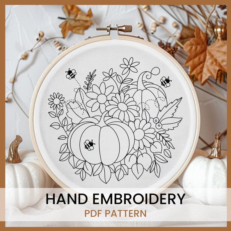 May include: Black and white embroidery pattern of pumpkins, flowers, and bees in a hoop. The pattern is titled "Hand Embroidery PDF Pattern".