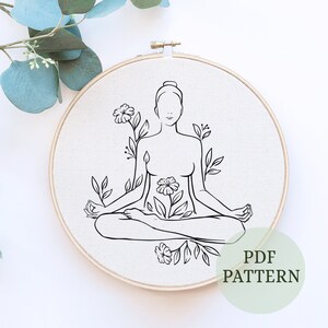 May include: Line art embroidery pattern of a person sitting in a lotus pose with flowers growing from their body. The pattern is on a white background and is labeled "PDF PATTERN".