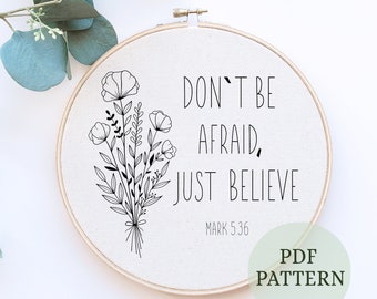 May include: A black and white embroidery pattern featuring a floral bouquet and the quote "Don't be afraid, just believe. Mark 5:36".