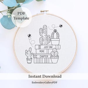 May include: Black and white line art embroidery pattern of a stack of books with cacti and bees. The books have the words "Just One More Chapter" on them. The pattern is in a hoop.