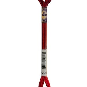 May include: A single skein of DMC embroidery floss in a deep red color, labeled as color 4205. The floss is tightly wound around a cardboard core with a printed label. The label includes the DMC logo and a barcode.