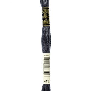 May include: A skein of DMC embroidery floss in color 413, a dark gray. The floss is wound around a cardboard spool with a gold label that reads "DMC Special Mouliné 25m (8.7 yd)" and a barcode. The spool is labeled with the color number 413.