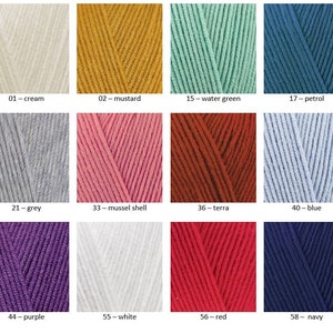 May include: A colour chart showing 12 different yarn colours. The colours are: cream, mustard, water green, petrol, grey, mussel shell, terra, blue, purple, white, red, and navy.