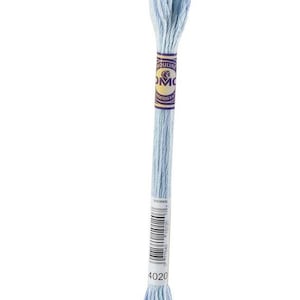May include: A single skein of light blue embroidery floss. The floss is wrapped with a paper label that reads "Mouliné DMC" in gold lettering. The color code "4020" is printed on the bottom of the label. The floss is a soft, pastel blue.