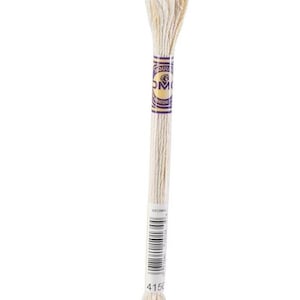 May include: A single skein of off-white embroidery floss, labeled with the number 4150. The floss is wrapped with a purple and gold label that reads "Mouliné Spécial DMC". The barcode is visible on the label.