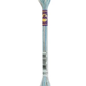 May include: A skein of DMC embroidery floss in shades of light blue, white, and gray. The floss is wrapped around a cardboard label with the DMC logo and product information. The color code is 1017.