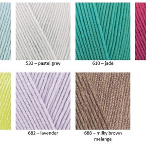 May include: A collection of yarn skeins in various colours, including light aqua, pastel grey, jade, ruby, lemon, lavender, and milky brown melange. Each skein is labelled with its colour name and number.