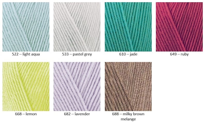 May include: A collection of yarn skeins in various colours, including light aqua, pastel grey, jade, ruby, lemon, lavender, and milky brown melange. Each skein is labelled with its colour name and number.