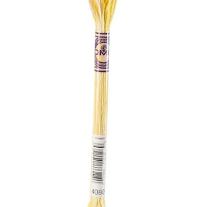 May include: A skein of yellow embroidery floss with a white and yellow blend at the ends. The floss is wrapped with a purple and gold label that has the brand name and a barcode. The number 4080 is printed on the label.