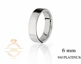 May include: A 6 mm wide platinum wedding band with a hammered finish. 950 PLATINUM.