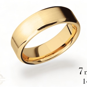 May include: A 7mm wide, 14K gold wedding band with a brushed finish.