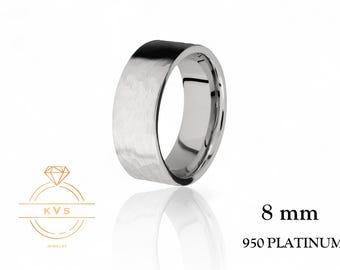 May include: A hammered 8 mm wide platinum wedding band. The band is made of 950 platinum.