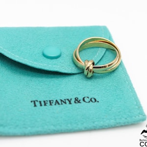 Bagues entrelacées Tiffany & Co. Paloma Picasso en or jaune 18 carats avec pochette