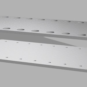 May include: A white two-tiered stand with red supports. The stand has multiple holes on each level, likely for holding tools or other items.
