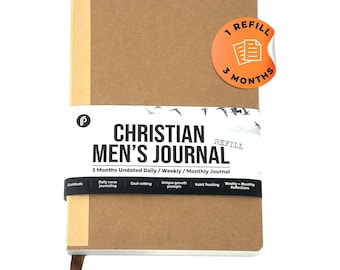 May include: A brown journal with the text "Christian Men's Journal" and "3 Months Undated Daily/Weekly/Monthly Journal". The journal has a sticker that says "1 Refill 3 Months".
