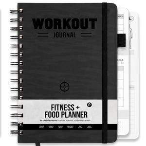 May include: A black spiral-bound workout journal with a camouflage pattern. The cover features the text WORKOUT JOURNAL, a target icon, and a white band labeled FITNESS + FOOD PLANNER with 90 Undated Trackers. An elastic strap secures the notebook.