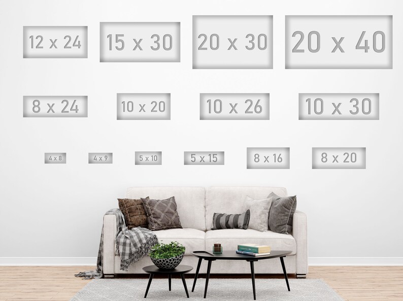 May include: A white wall displays various rectangular art print sizes, including 12x24 inches, 15x30 inches, and 20x40 inches. A sofa with pillows and a coffee table are in the foreground.