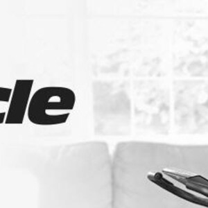 May include: Black and white image featuring the text "Slim Cycle". A woman is using the exercise equipment, holding the resistance bands. The background includes a window and a couch. The equipment appears to be a stationary bike.