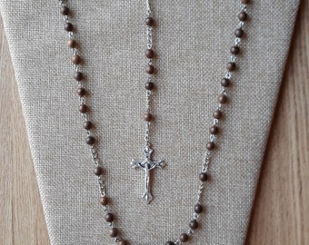 Rosary with polished wood beads, Our Lady of Grace centerpiece and detailed Crucifix