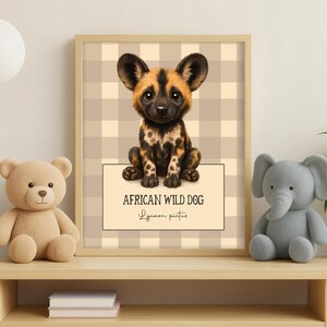 May include: A framed print featuring an illustration of an African wild dog. The dog has a spotted coat with black, brown, and tan markings. The print includes the text "AFRICAN WILD DOG Lycaon pictus" on a cream-colored background.