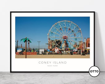 May include: A framed print featuring a daytime view of Coney Island, New York. The image showcases the iconic Ferris wheel against a clear blue sky. The text "CONEY ISLAND NEW YORK" is printed at the bottom of the image.