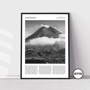 May include: A black and white photograph of a mountain range in Indonesia. The image features a large, imposing mountain with clouds swirling around its peak. The text "INDONESIA" and "SOUTHEAST ASIA 6.1887° S 112.8031° E" is printed at the top of the image.